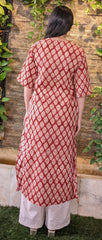 Girl standing wearing Kurtha by Neelmii